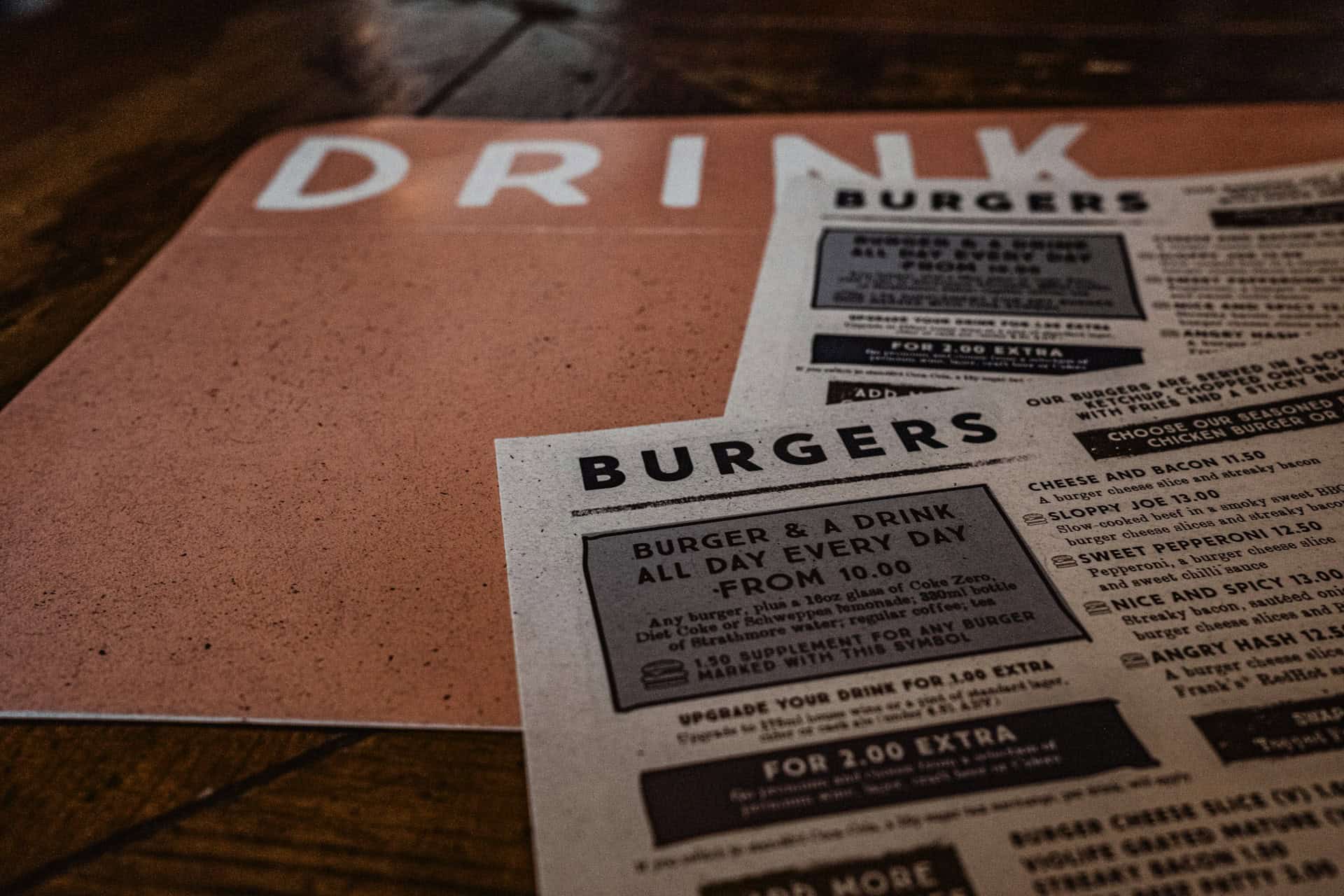 Restaurant menu on rustic wooden table highlighting Staffino's customer experience solutions.