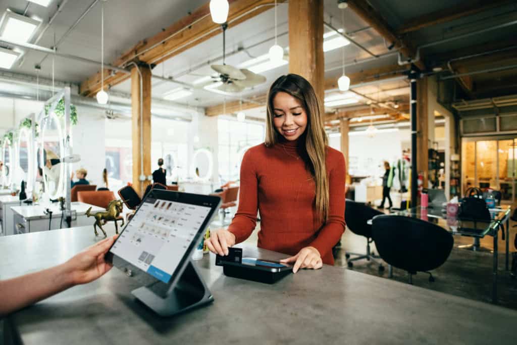 satisfied customer paying at the counter